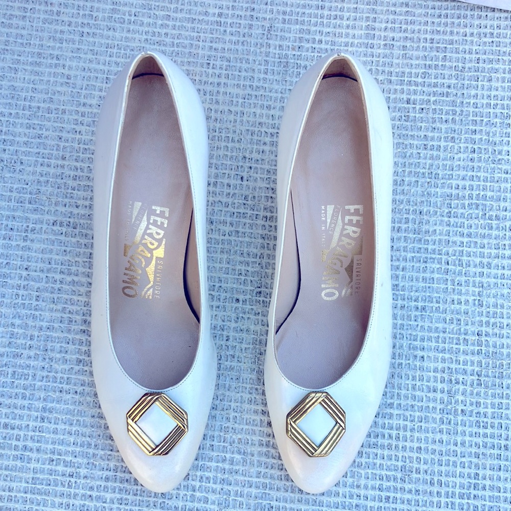 White or cream. Ferragamo ladies heels or pump with gold  on the tow